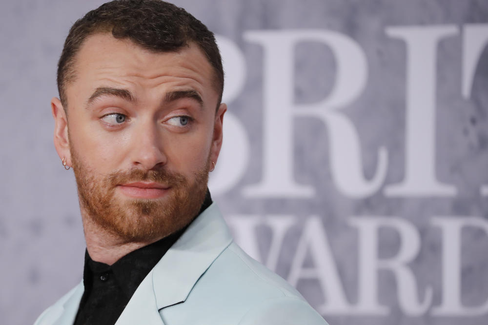 Sam Smith on the red carpet at the BRIT Awards in February 2019 — the British singer-songwriter came out as nonbinary later that year.