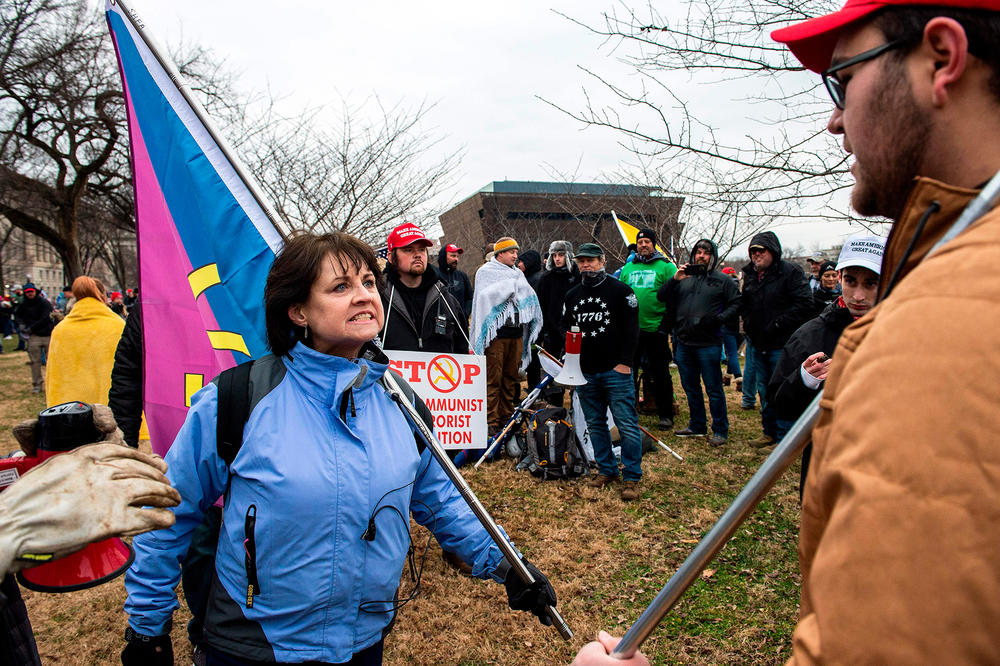 Ianni argues with another person on Jan. 6 near the pro-Trump rally that preceded the attack on the U.S. Capitol.