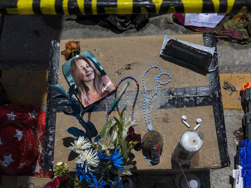 A memorial contains personal items of some of the missing from the collapsed Champlain Towers South in Surfside, Fla.