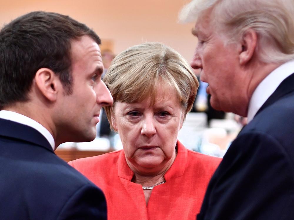 German Chancellor Angela Merkel with then-President Donald Trump and French President Emmanuel Macron at the start of the G-20 meeting in Hamburg, Germany, in July 2017.