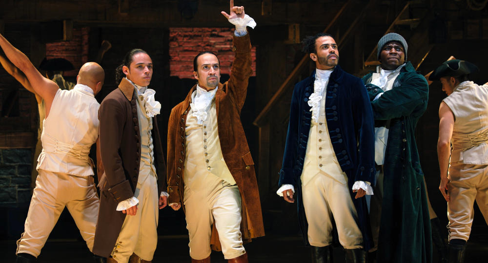 John Laurens (Anthony Ramos), Alexander Hamilton (Lin-Manuel Miranda), the Marquis de Lafayette (Daveed Diggs) and Hercules Mulligan (Okieriete Onaodowan) in the filmed version of the original Broadway production of <em>Hamilton.</em>