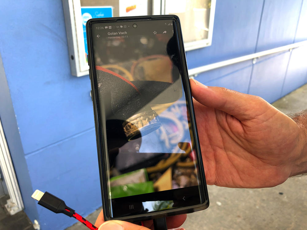 Charles Burkett, the Surfside mayor, said a member of the Israeli Defense Forces who was assisting in the recovery effort showed him a photo of a gold ring he found in the rubble.