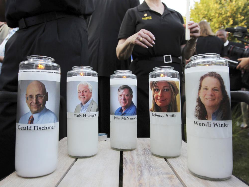 Five employees of the <em>Capital Gazette</em> newspaper are honored across the street from the newsroom where they were killed in Annapolis, Md.