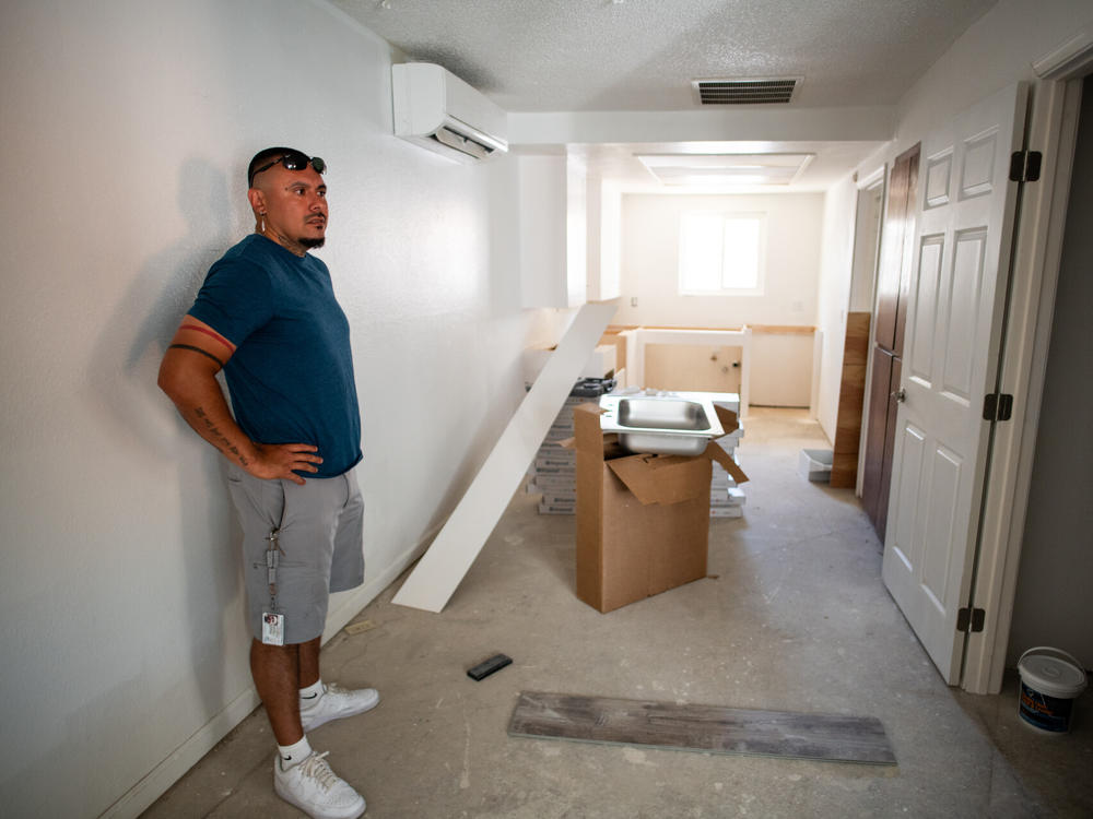 Joshua Ray, a social worker with the Scotts Valley Band of Pomo Indians, inside one of the apartments of the building tribal leaders bought in Lakeport, Calif., through Homekey.