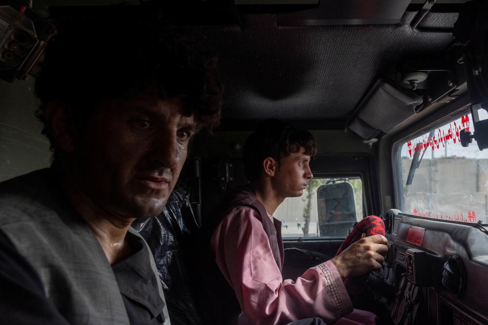 Ahmad Shah, 28, an Afghan policeman, sits in an armored vehicle after being rescued by Afghan special forces, in Kandahar province on July 13, 2021.