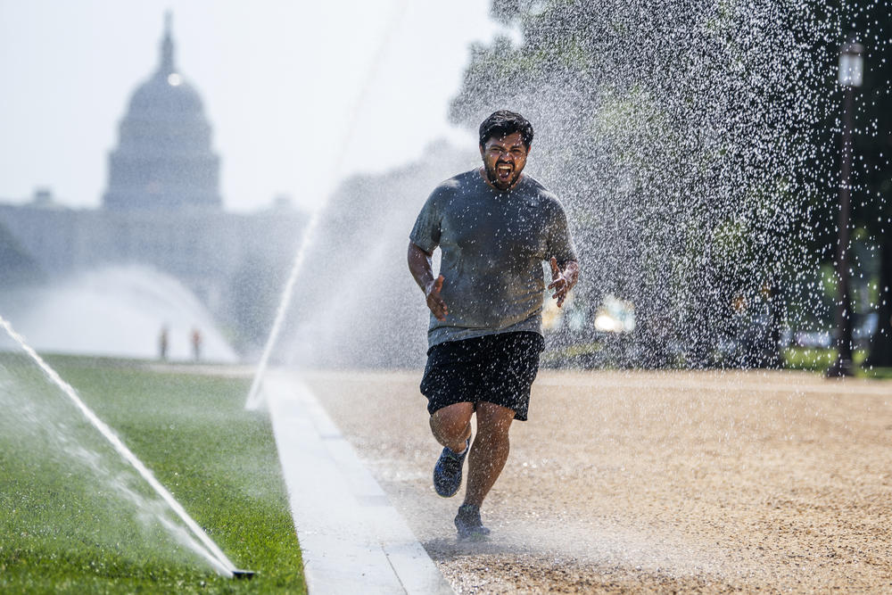 If you must exercise when the the sun is high, dousing yourself with water, as this jogger did last month in steamy Washington, D.C., could help cool you down.
