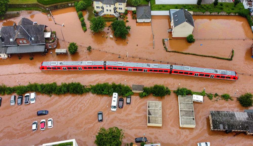 A regional train is stuck in floodwaters at a station in Kordel, Germany. Power went out, and the train came to a halt on Wednesday.