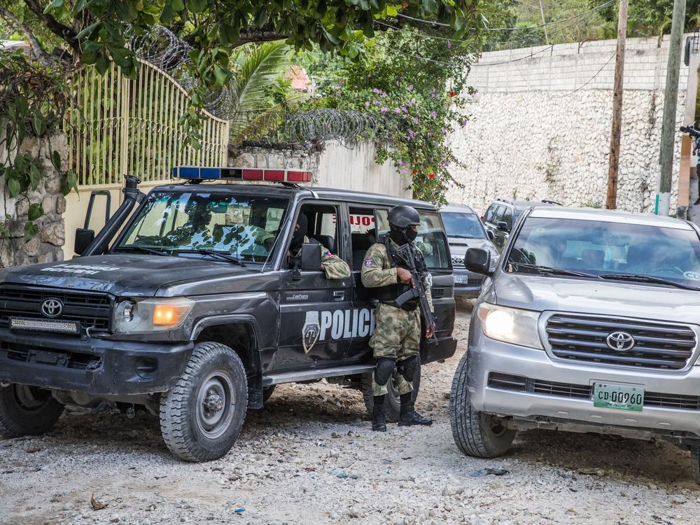 Police stand guard Thursday outside the residence of the late Haitian President Jovenel Moïse in Port-au-Prince after his assassination last week.