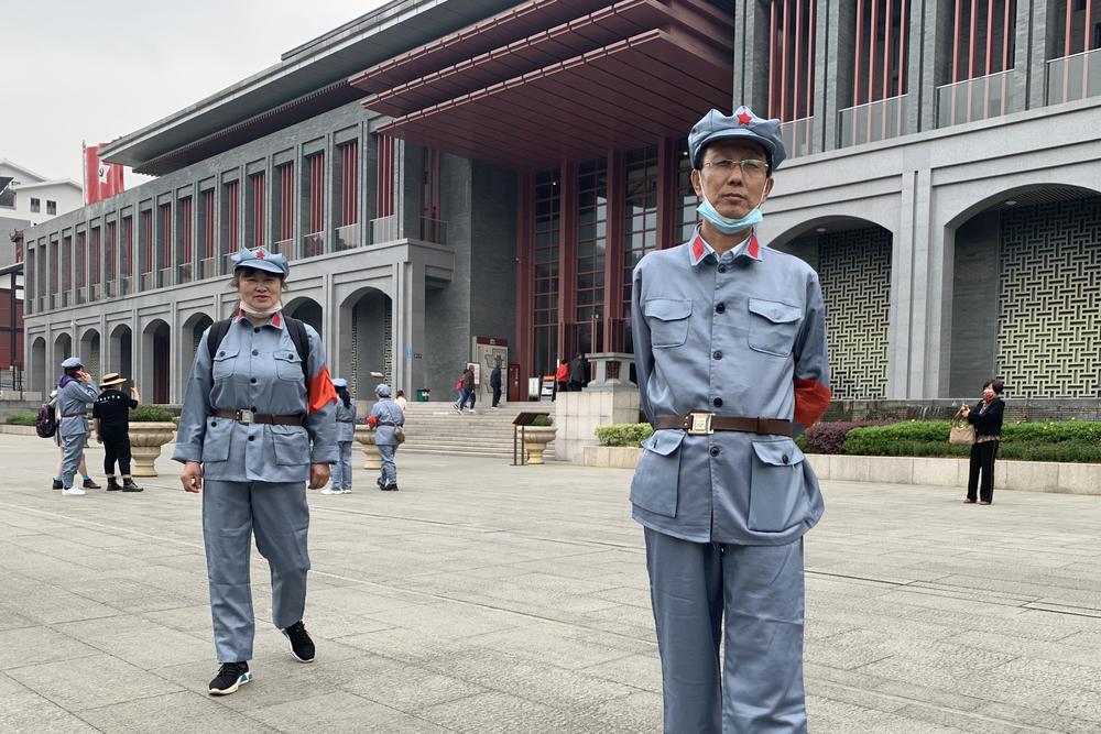 Tourist Wang Xiu visits Zunyi dressed up in a rented costume to look like a People's Liberation Army soldier who fought under Mao Zedong. 