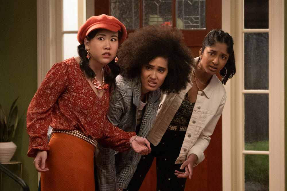 (L To R) Ramona Young as Eleanor Wong, Lee Rodriguez as Fabiola Torres, and Maitreyi Ramakrishnan as Devi Vishwakumar in <em>Never Have I Ever</em>.