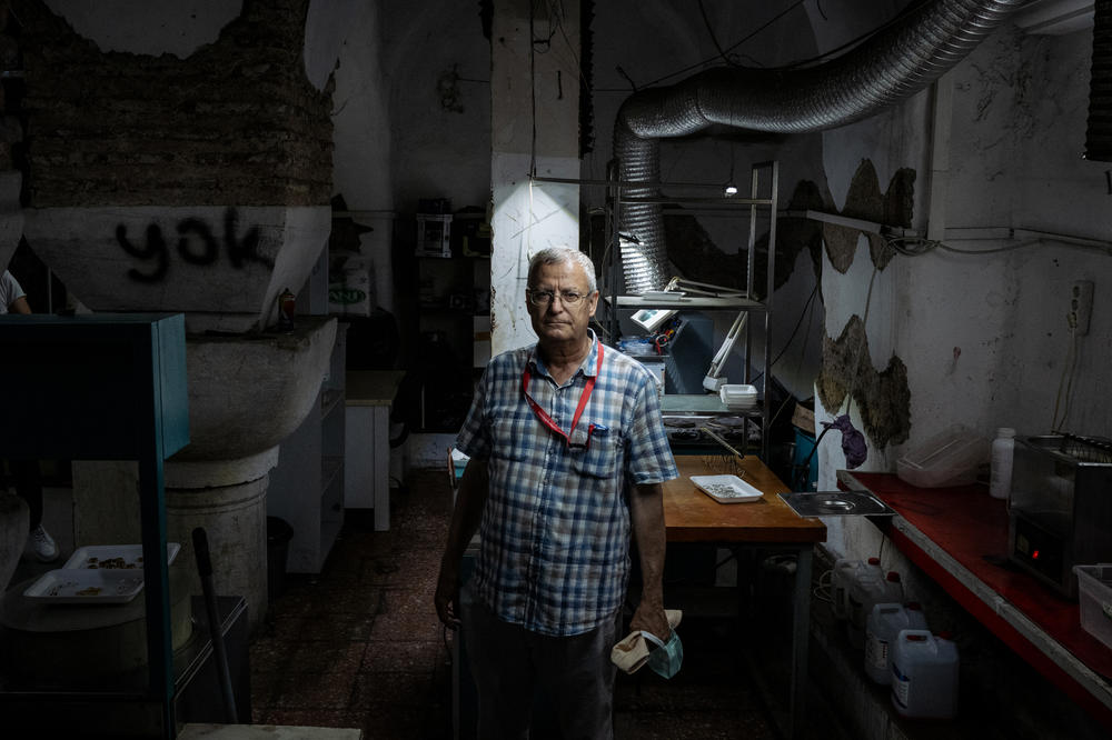 Ozgumus stands in a former cistern built in the 6th century, now the site of a jewelry workshop.