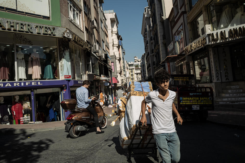 A courier carts goods through the busy commercial district near Beyazit Square — formerly the Forum of Theodosius, built by the Roman emperor Constantine the Great.