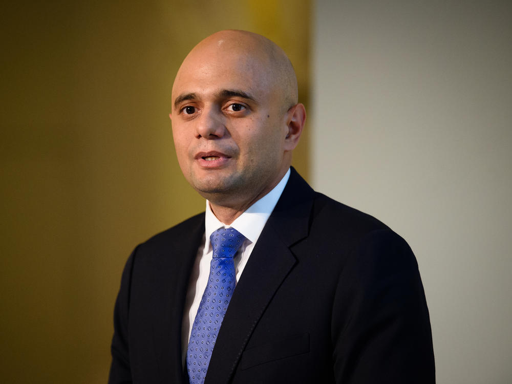 U.K. Health Secretary Sajid Javid, pictured in 2015, tested positive for coronavirus on Saturday. The nation is poised to lift sweeping restrictions, despite a spike in cases led by the delta variant.