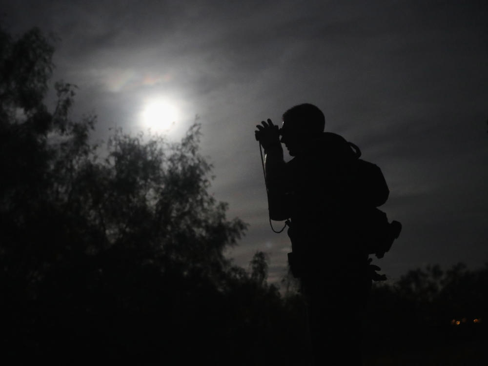 A U.S. Border Patrol agent uses night vision goggles near Roma, Texas in August 2016. More than 100 such devices have gone missing from the Fort Hood Army post near Killeen, Texas.