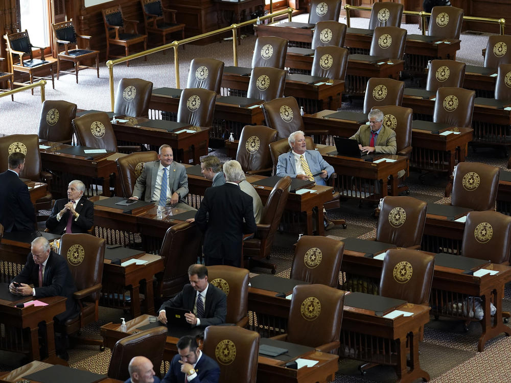 Empty seats are seen in the House Chamber at the Texas Capitol, Tuesday, July 13, 2021, in Austin, Texas. Texas Democrats left the state to block sweeping new election laws, while Republican Gov. Greg Abbott threatened them with arrest the moment they return.
