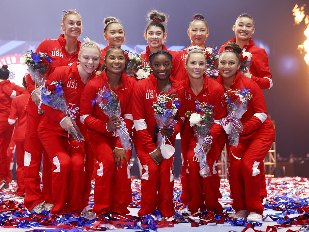 The women representing Team USA, including six team members and four alternates, pose last month after the U.S. Gymnastics Olympic trials in St. Louis. Kara Eaker, an alternate, has tested positive for the coronavirus, her gym says.