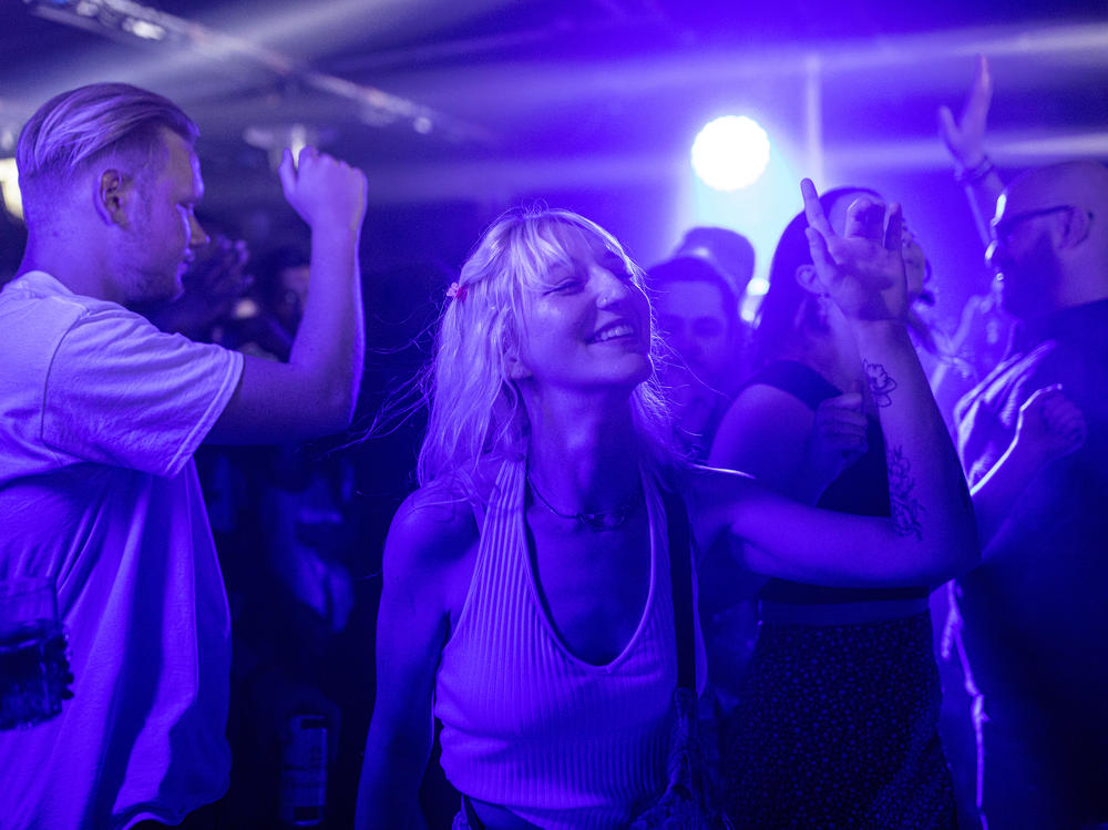 People dance at Egg London nightclub early Monday in the British capital.