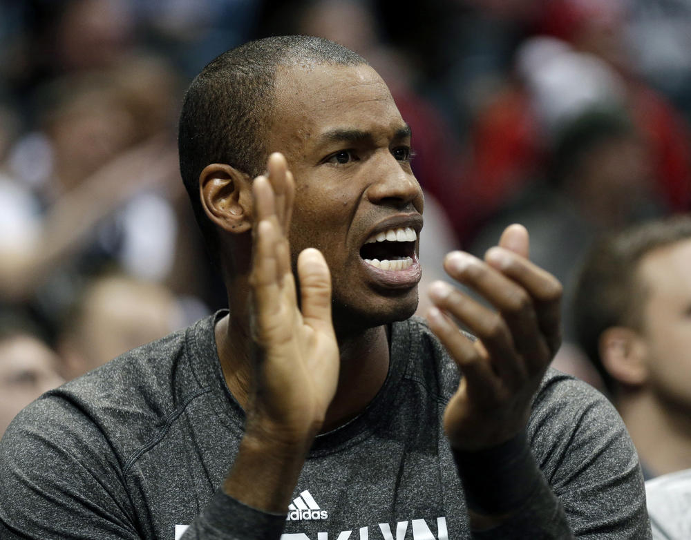 Jason Collins reacts from the bench at an NBA game in Milwaukee on March 1, 2014.
