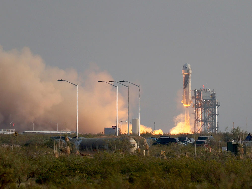 Blue Origin's New Shepard rocket lifts off from the launch pad Tuesday morning in Van Horn, Texas.