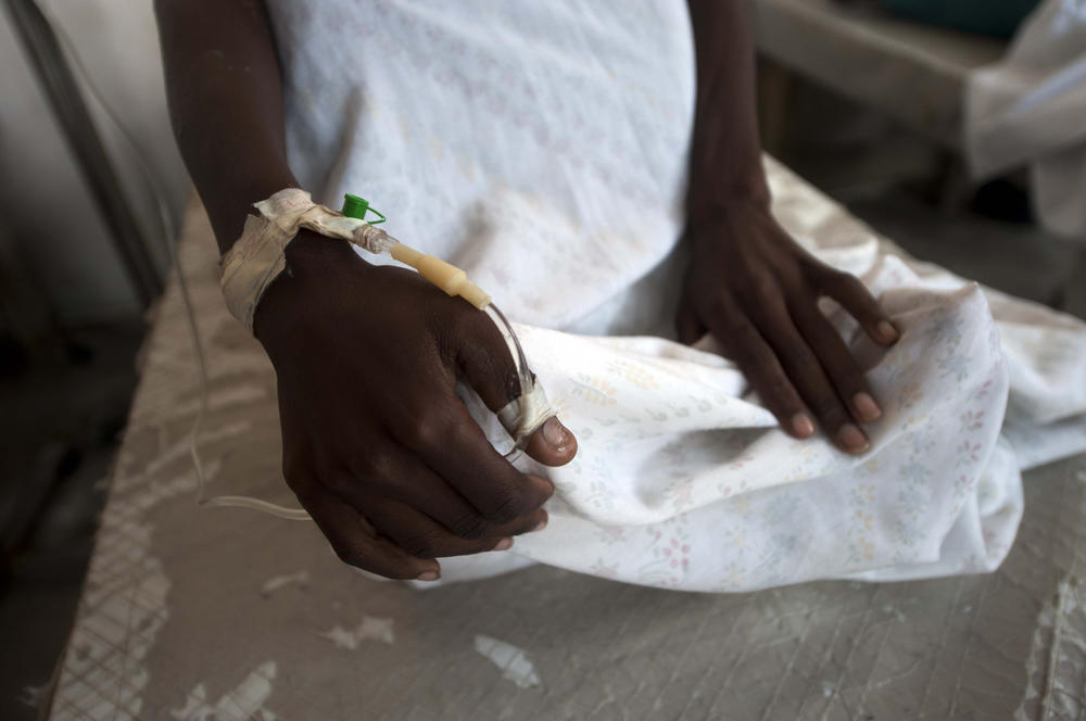 A cholera patient arrives at the Cholera Treatment Center in the Carrefour area of Port-au-Prince, on December 10, 2014. The Caribbean country's cholera outbreak started in 2010 and 
