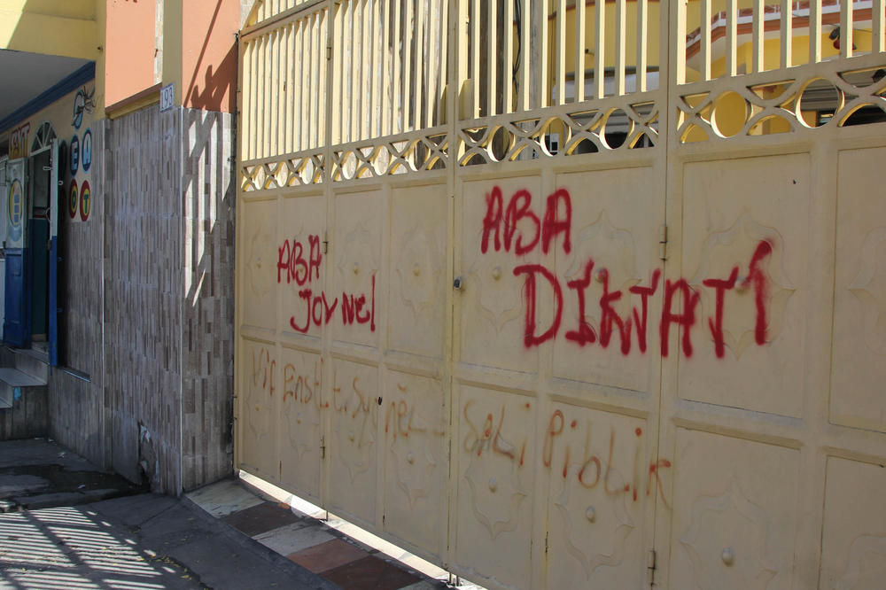 President Moïse was a polarizing figure in Haiti. Graffiti in Port-au-Prince from before his assassination says, 