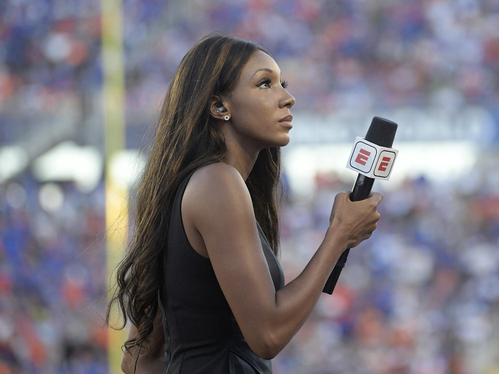 ESPN's Maria Taylor works from the sidelines during an NCAA college football game between Miami and Florida in 2019. ESPN announced Wednesday that Taylor is leaving the network.
