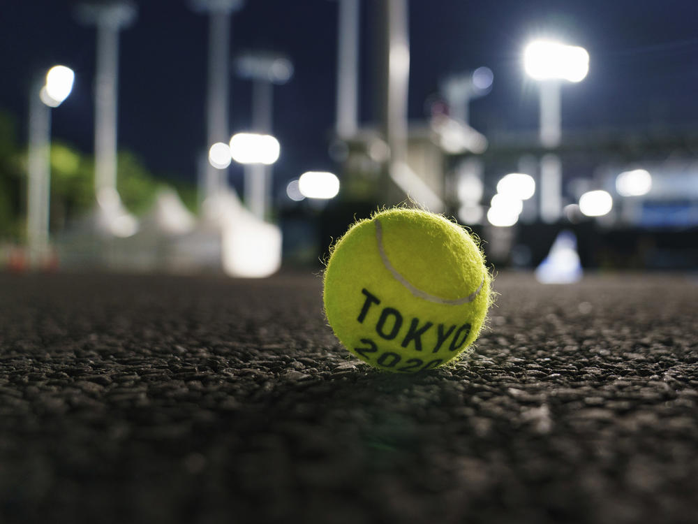 A ball sits outside a court at the Ariake Tennis Park during practice sessions at the Tokyo Olympics on Tuesday.