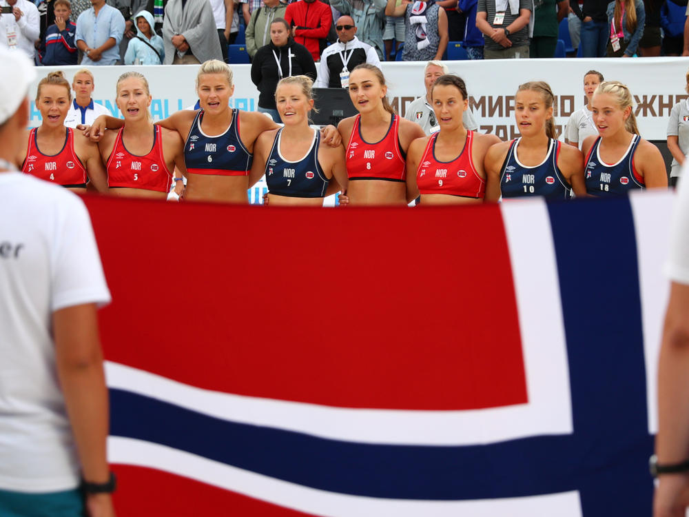 The Norwegian women's beach handball team is being fined for wearing shorts during a recent tournament game. The team is seen here after a game in 2018.