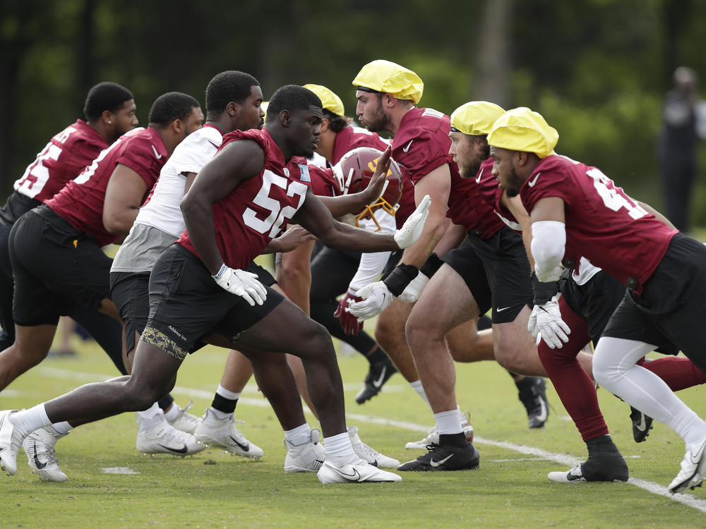 The Washington Football Team during a June practice. The team was one of the last in the league to reach a 50% vaccination threshold among its players.