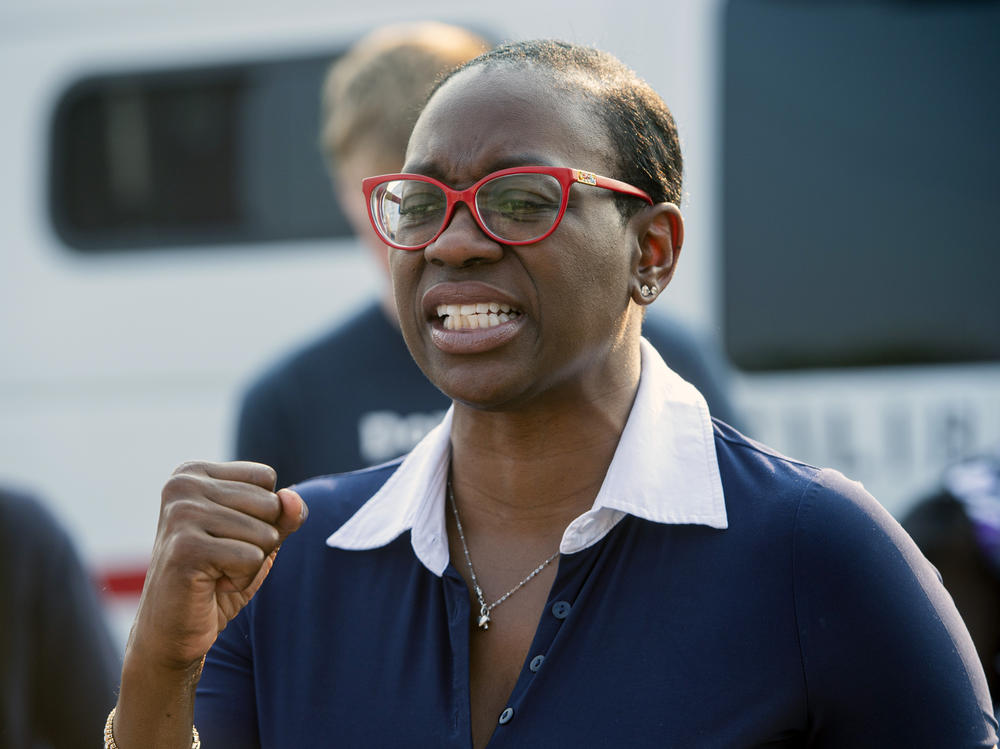 Nina Turner, a candidate running in a special Democratic primary for Ohio's 11th Congressional District, speaks with supporters near the Cuyahoga County Board of Elections in Cleveland before casting her early vote on July 7.