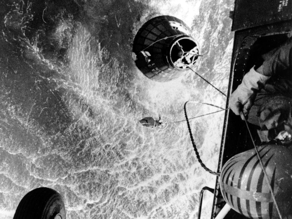 A U.S. Marines helicopter hovers over the Atlantic ocean during an attempt to retrieve astronaut Gus Grissom's Liberty Bell 7, which sank 15,000 feet shortly after splashdown on July 21, 1961.