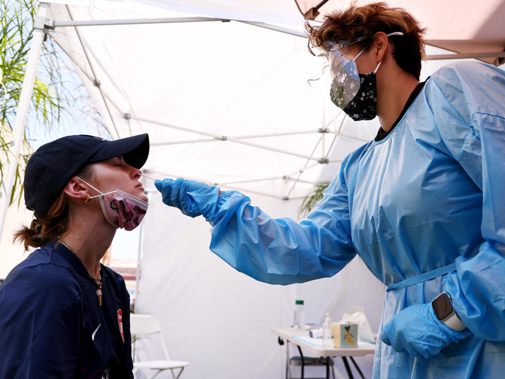 A medical assistant administers a coronavirus test last week in Los Angeles. COVID-19 cases are on the rise as the highly transmissible delta variant has become the dominant coronavirus strain in the United States.