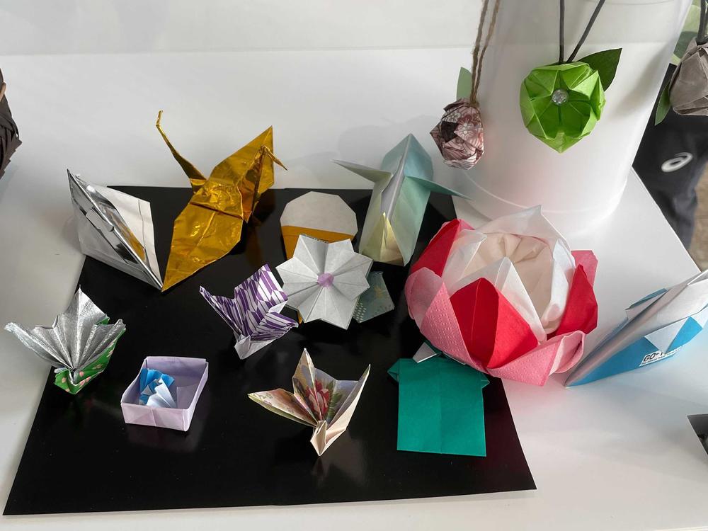 Volunteers at the center for media at the Tokyo Olympics made origami designs, including cranes and flowers.