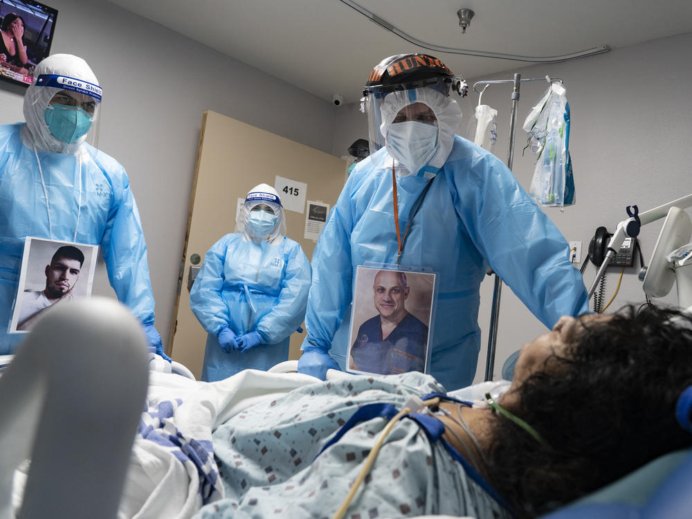 Medical staff members check on a patient in the COVID-19 Intensive Care Unit at United Memorial Medical Center in Houston last November. Doctors are now investigating whether people with lingering cognitive symptoms may be at risk for dementia.