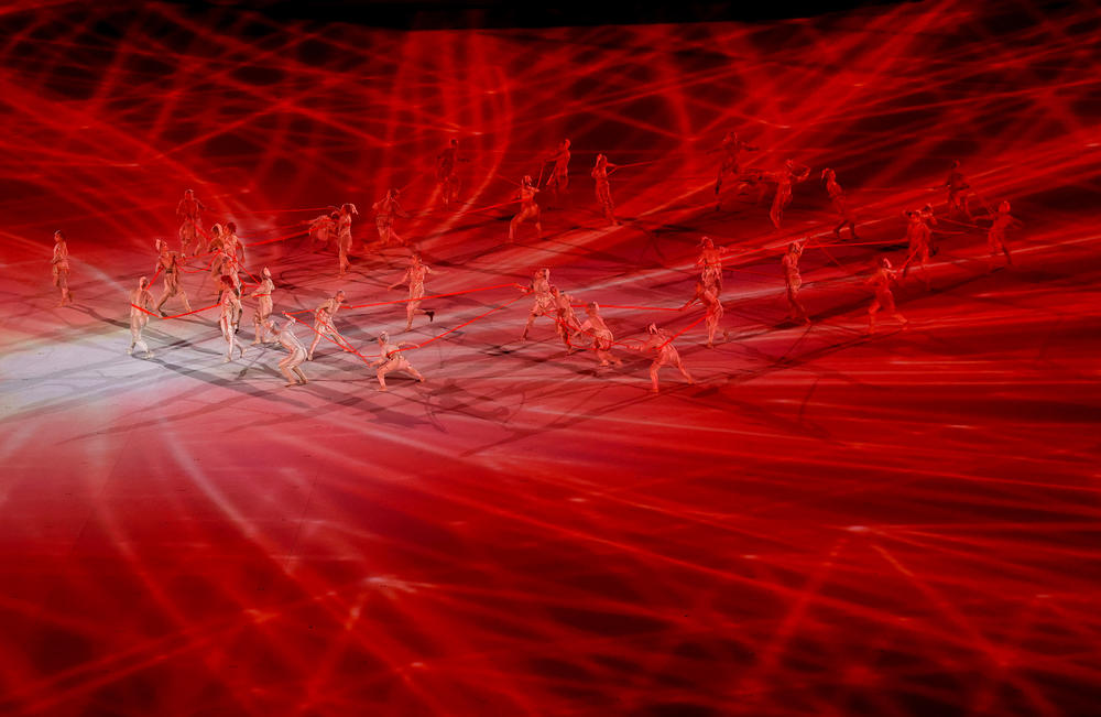 Performers dance during the opening ceremony Friday.