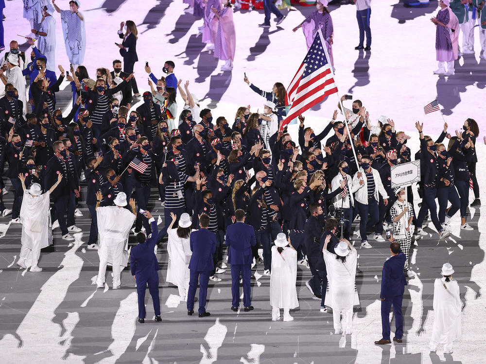Flag bearers Sue Bird and Eddy Alvarez of Team USA lead their team during the opening ceremony.