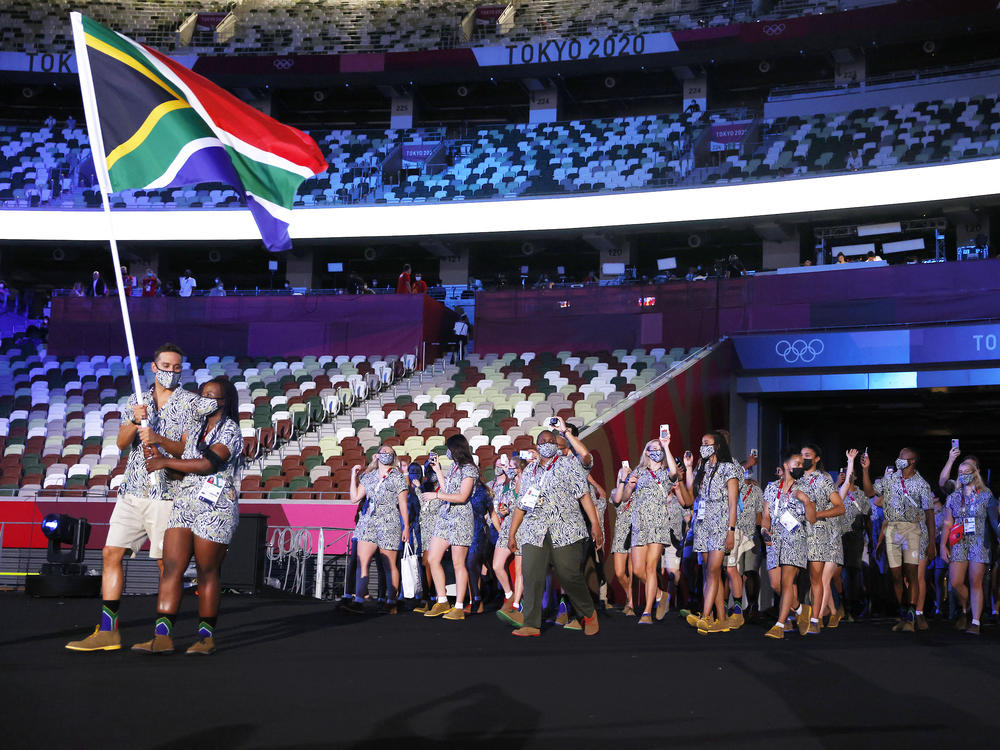Flag bearers Phumelela Luphumlo Mbande and Chad Le Clos of Team South Africa lead their team out during the opening ceremony of the Tokyo Olympic Games on Friday.