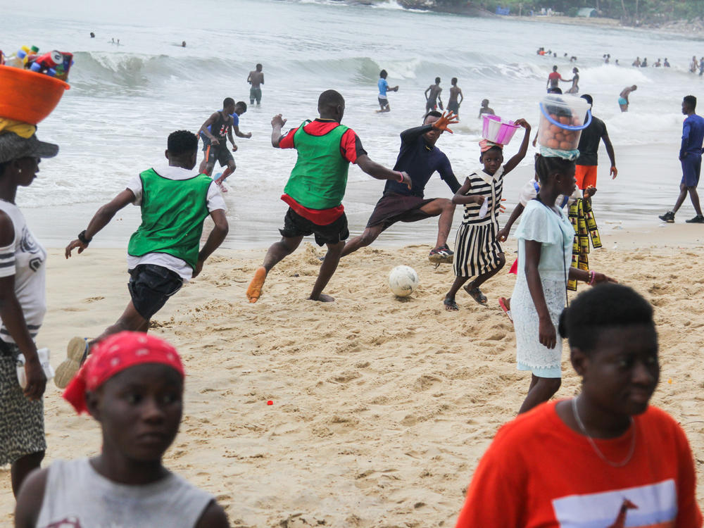 Soccer on the sand of Lumley Beach is a big Sunday pastime in Freetown, Sierra Leone. Pick-up games run up and down the shoreline.