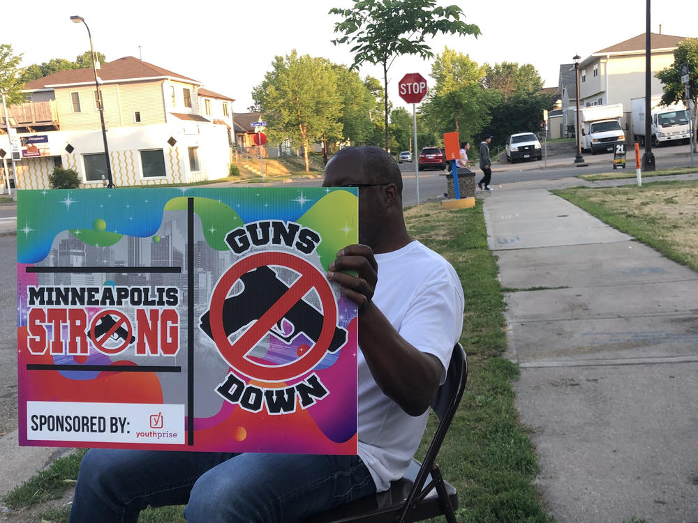 Church volunteers sit at a crime hotspot in North Minneapolis, trying to counter the neighborhood's recent increase in violence.