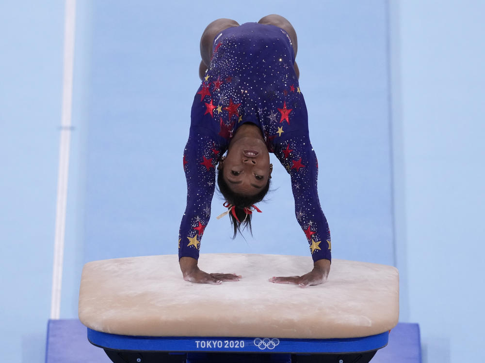 U.S. gymnastics star Simone Biles performs on the vault during the women's artistic gymnastic qualifications on Sunday at the 2020 Summer Olympics in Tokyo.