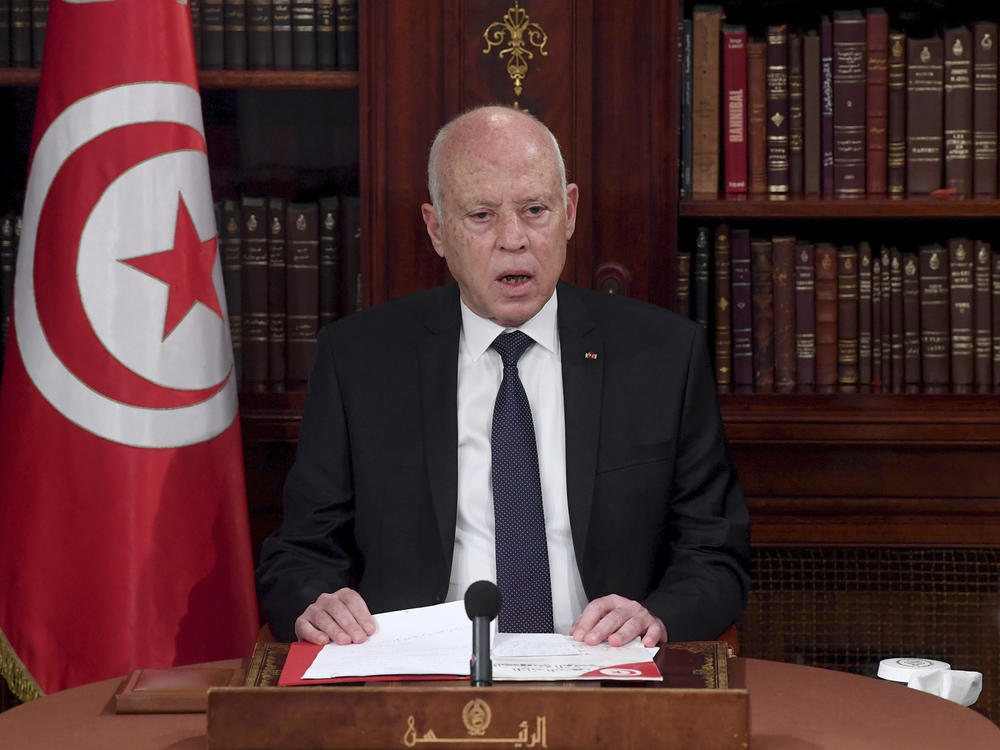 Tunisia's President Kais Saied leads a security meeting with members of the army and police forces in Tunis, Tunisia, on Sunday. Troops surrounded the parliament building and blocked its speaker Rached Ghannouchi from entering Monday after the president suspended the legislature and fired the prime minister following nationwide protests.