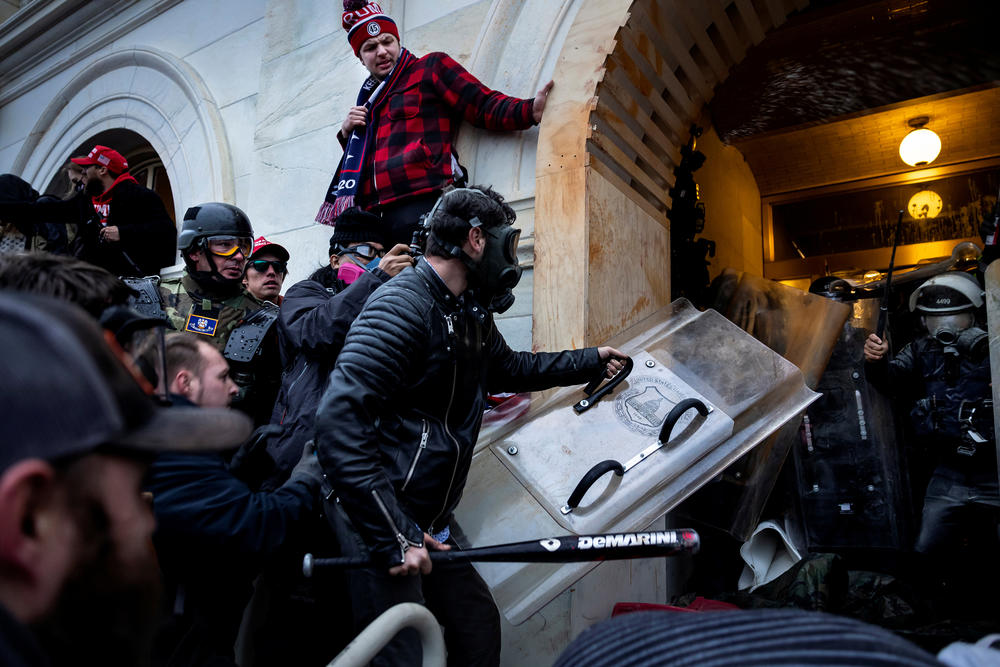 Rioters clash with police as they try to storm the U.S. Capitol. The Justice Department has created a kind of framework for prosecutions, dividing the Jan. 6 defendants into different categories based on what they are accused of doing that day.