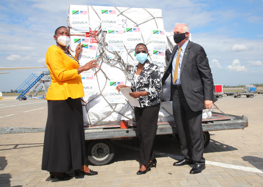 On July 24, Tanzanian Minister for Health Dr. Dorothy Gwajima (left) welcomes the first shipment of COVID-19 vaccines at the Dar es Salaam airport. She had previously endorsed a drink made from garlic, ginger and lemons as a treatment for the virus. She's standing with Foreign Affairs Minister Liberata Mulamula (center) and U.S. Ambassador to Tanzania Donald Wright.