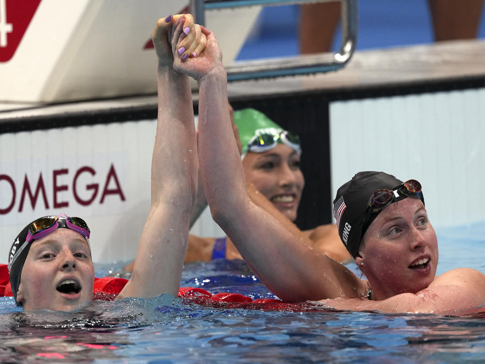 U.S. gold medalist Lydia Jacoby (left) is congratulated by bronze medalist and compatriot Lilly King after winning the final of the women's 100-meter breaststroke.