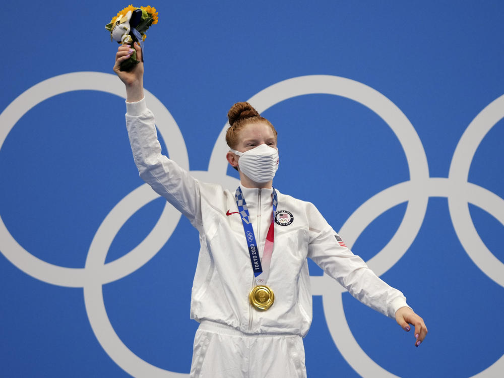 Gold medalist Lydia Jacoby of the United States celebrates on the podium after the final of the women's 100-meter breaststroke.