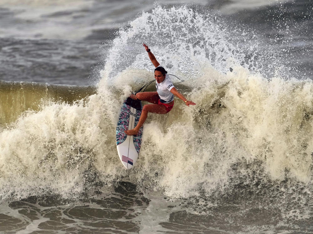 Carissa Moore from the U.S. performs on the wave during the gold medal heat in the women's surfing competition at the Summer Olympics on Tuesday in Ichinomiya, Japan.