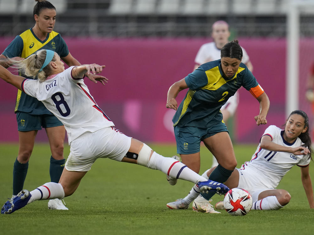 Australia's Sam Kerr and Julie Ertz of the U.S. battle for the ball during a women's soccer match at the Tokyo Olympics on Tuesday.