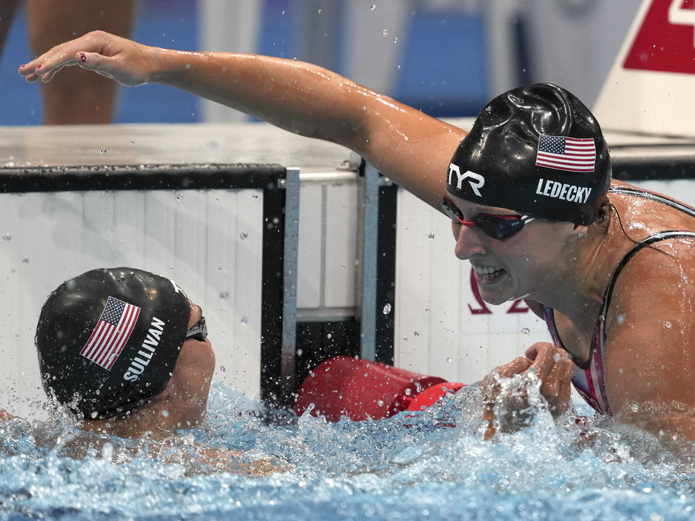 U.S. swimmer Katie Ledecky embraces teammate Erica Sullivan after winning the women's 1,500 meter freestyle.