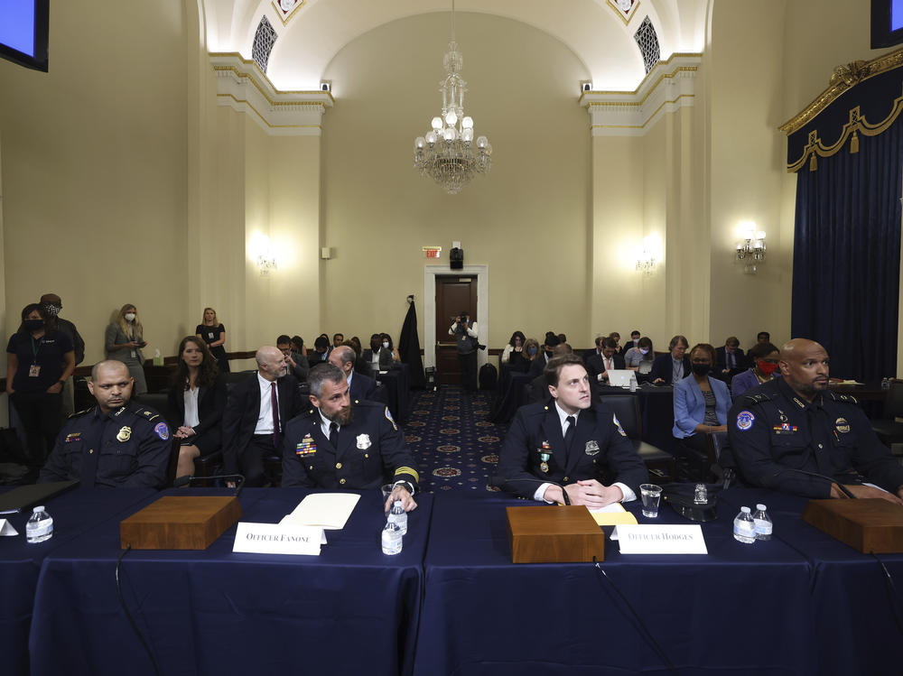 From left: U.S. Capitol Police officer Aquilino Gonell, Washington Metropolitan Police Department officer Michael Fanone, Washington Metropolitan Police Department officer Daniel Hodges and U.S. Capitol Police officer Harry Dunn arrive to testify at the House select committee hearing on the Jan. 6 attack on Capitol Hill on Tuesday.