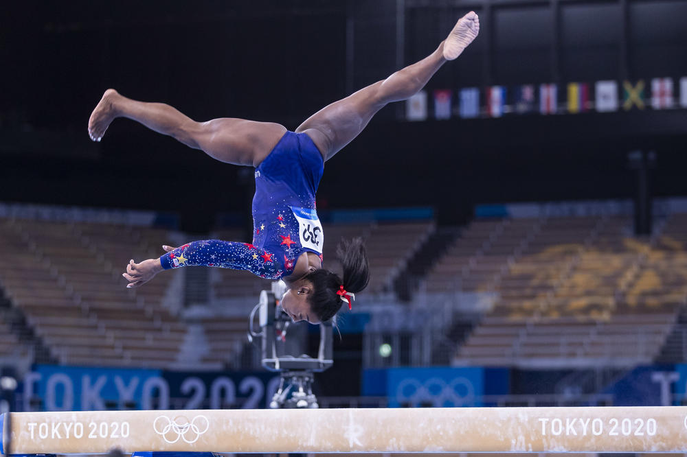 Biles competes on the balance beam during qualification at the Olympic Games on Sunday in Tokyo.